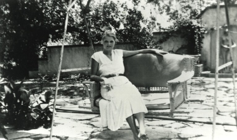 <em>Ruth Reed in the garden on the south side of the Byrne-Reed House. Courtesy of the Reed family.</em>