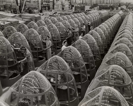Women aircraft workers finishing transparent bomber noses for fighter and reconnaissance planes at Douglas Aircraft Co. Plant in Long Beach, California
